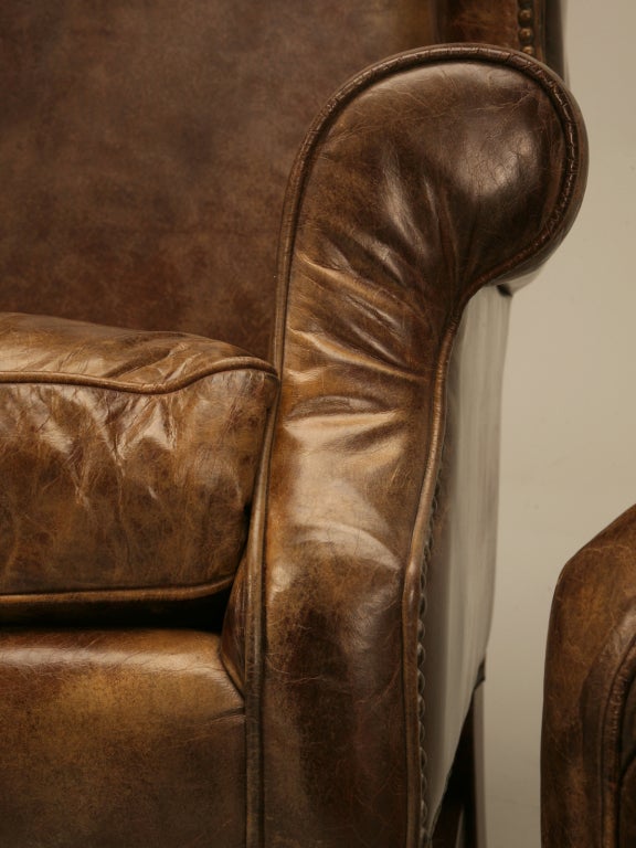 Outstanding Pair of Vintage Distressed Bomber Leather Wing Back Chairs In Good Condition In Chicago, IL