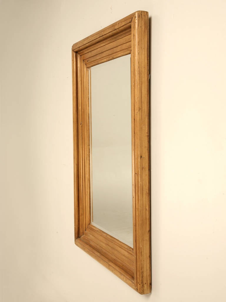 C1900 antique English scrubbed pine mirror with a beautifully detailed frame in a warm old pine color that only comes with age. Natural beeswax finish.