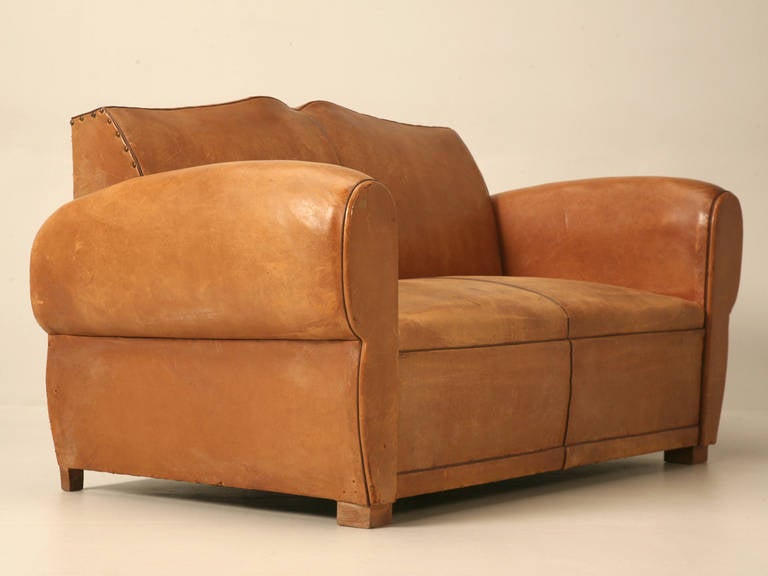 C1930-1940 French moustache back sofa with its original leather. Whenever we purchase one of these sofa’s, they invariably double as a sleeper bed, and sit God awful. Just picture a concrete park bench and you’ll get the idea. This time we decided