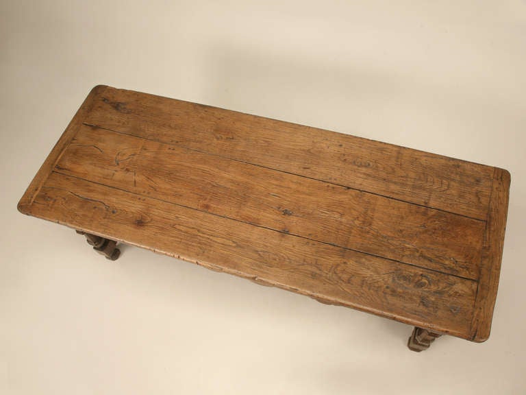 Reigning from the 1600s, this solid white oak table was found in France. Original hand-wrought iron hardware is useful when opening the thick drawers. With massive amounts of character, this table is a beautiful specimen.

As far as conservation