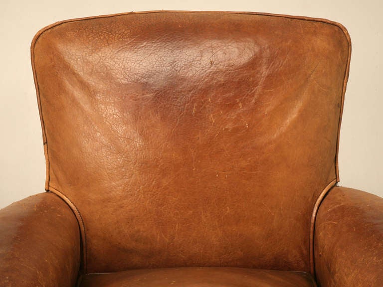 Yippee! Exactly what you'll exclaim while sitting in one of these awesome vintage French leather club chairs. Completely gone through by our own in-house upholstery department, they carefully removed the leather to redo the insides. Done correctly,