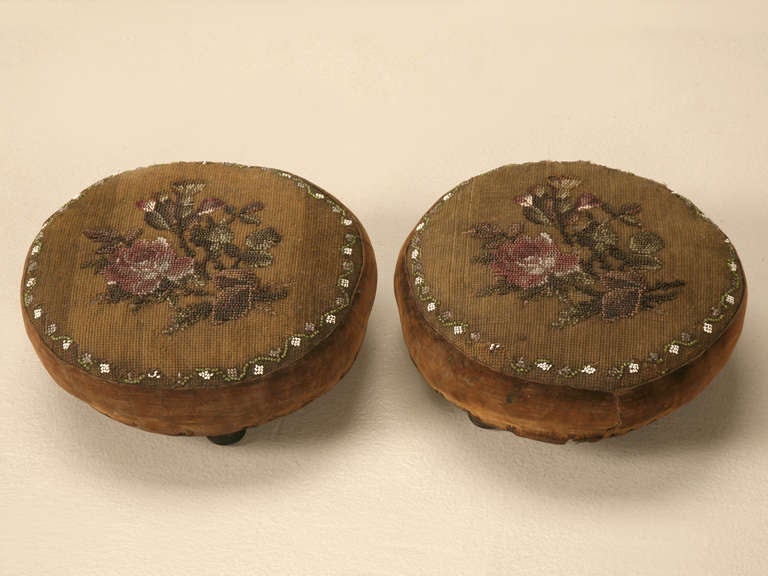A rare find. An actual pair of footstools. Most pairs of anything usually are separated over the years. The colors of these stools are truly beautiful, see detailed photos. Reinvent their use in todays home. Very interesting and decorative. Adds