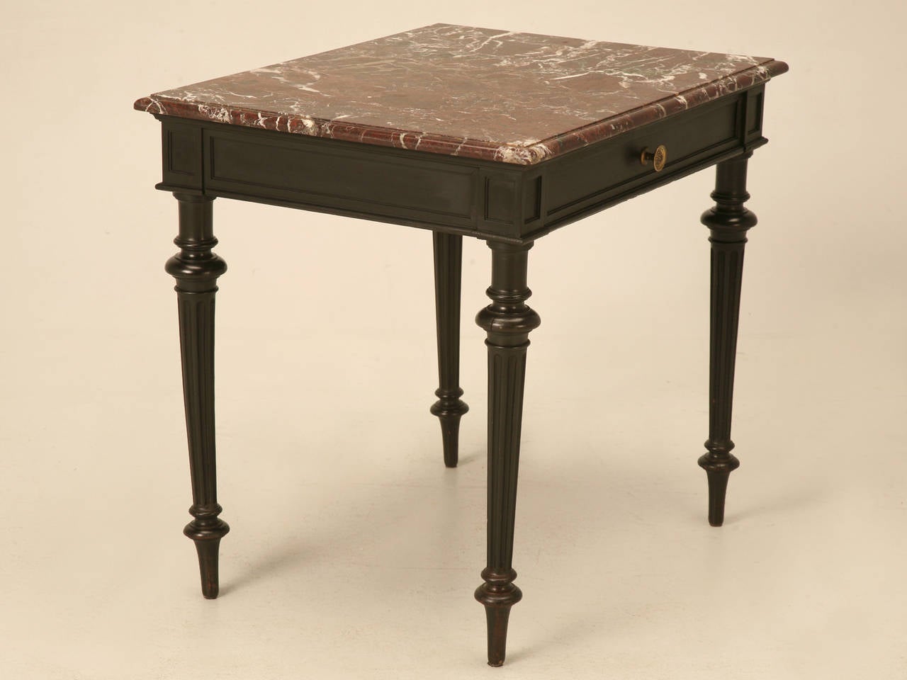 Unusual scale Napoleon III end table, or small writing desk, circa 1880-1900. The black is an original ebonized finish applied over 100 years ago and lets a slight glimmer of the brown of the oak peek through. Beautifully hand dove-tailed drawers,