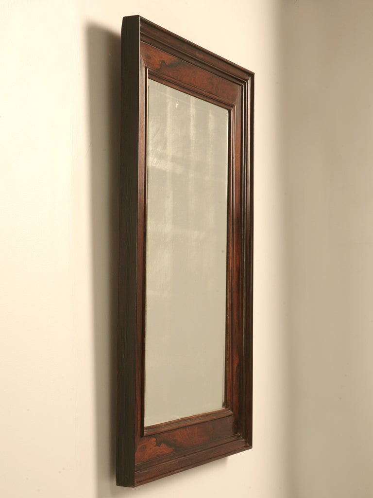 Not just any mirror here, this mirror offers a true rugged handsomeness to the aged patina of the glass itself. This fine mirror represents itself with plenty of charm, character, and exotic qualities, too. Whether you are searching for a mirror to