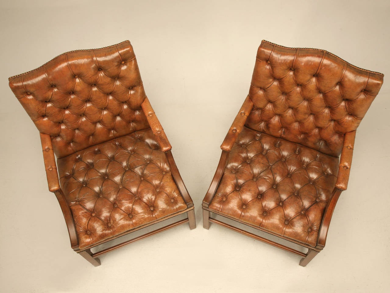 British Pair of English Button Tufted Leather Vintage Chesterfield Armchairs