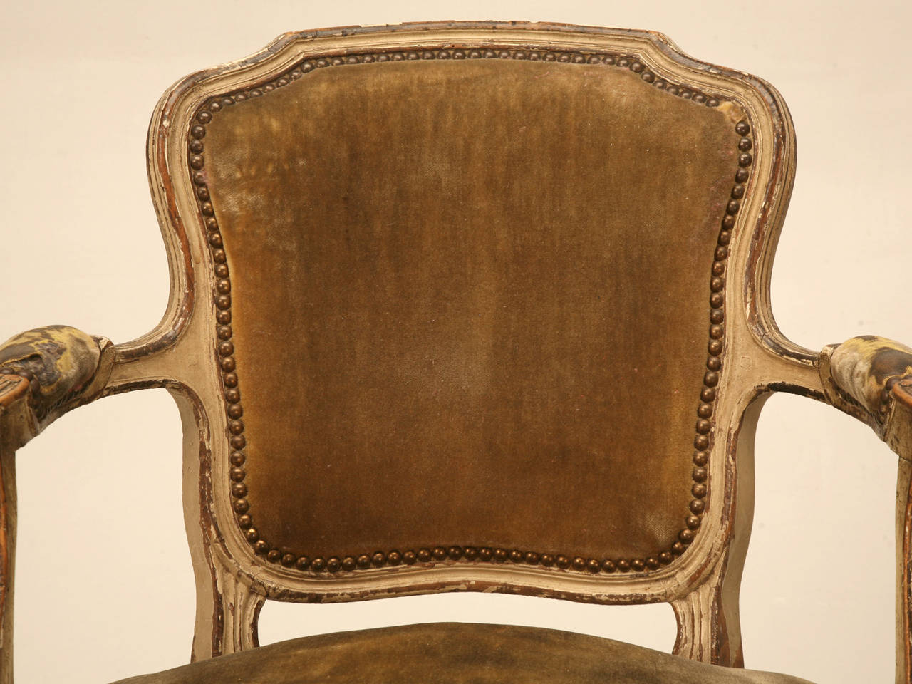 Circa 1820-1840 Louis XV style armchairs with unbelievable old paint, and in fact, the paint is so good and authentic we are studying it to see how well we can duplicate it. There is old paint, and there is paint restoration like some dealers prefer