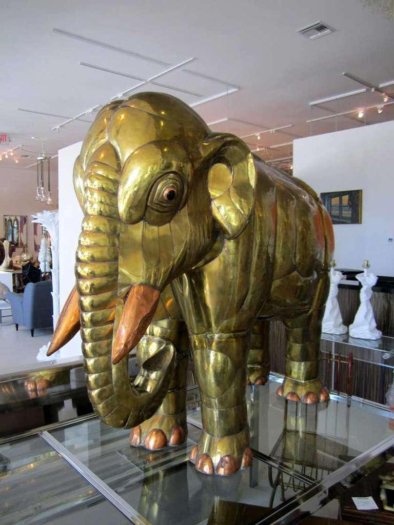 Large Sergio Bustamante brass mixed metal elephant sculpture with copper accents featured on the tusks, feet and around the eyes.