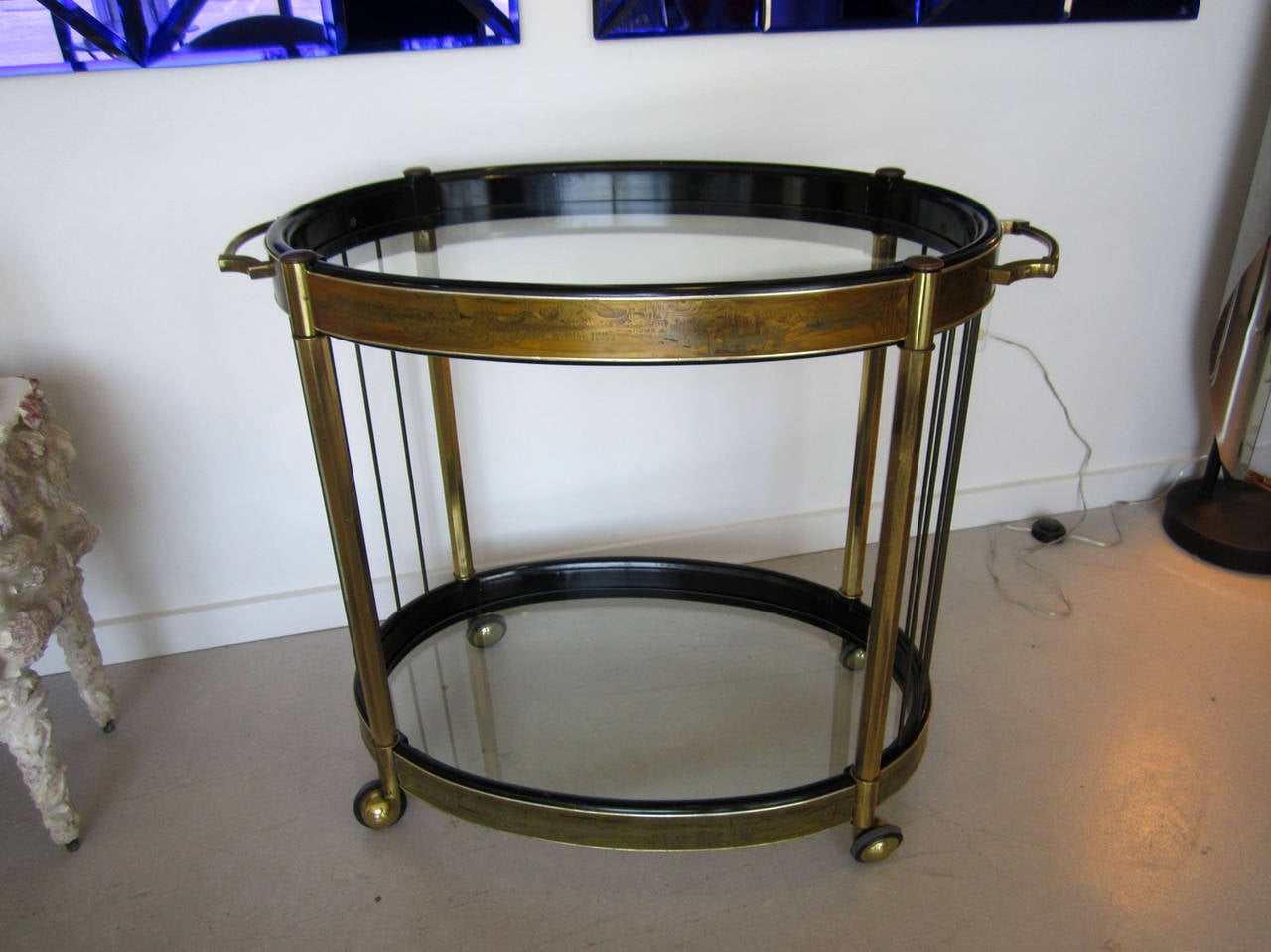 Brass oval bar cart by Bernhard Rohne for Mastercraft.