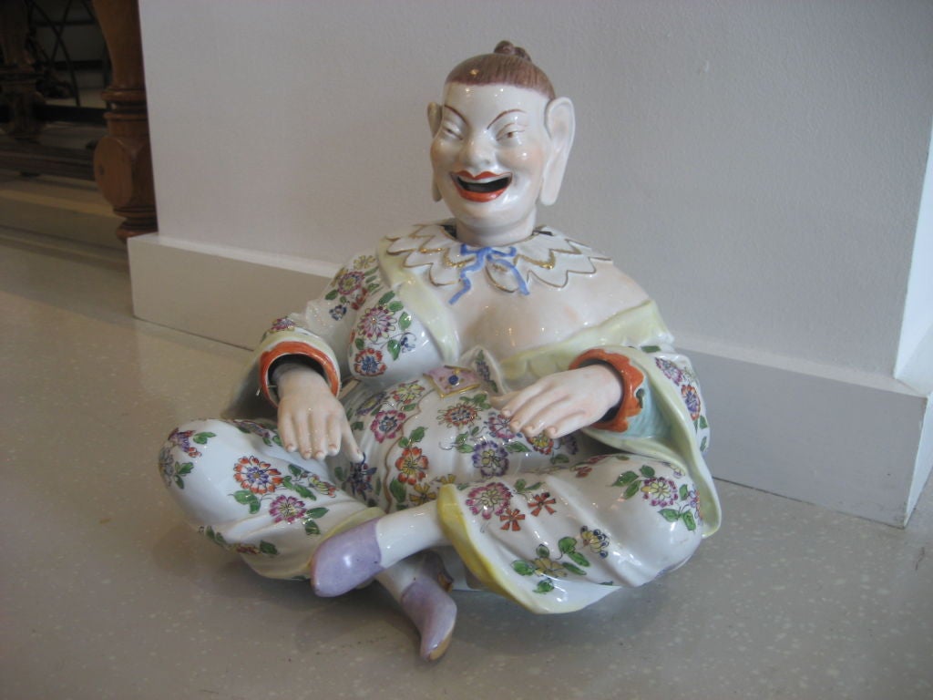 Iconic oriental figure in porcelain with painted costume by Dresden of Germany. Popular in the mid- to late 19th Century this nodder is rare and mint. It is signed.