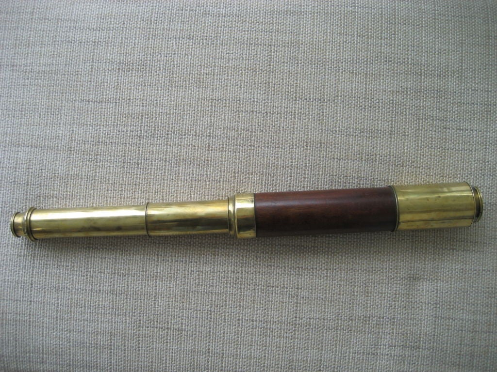 Large day or night brass and mahogany barrel extension telescope. The manufacturer is Dollond of England and the date is c1840.
