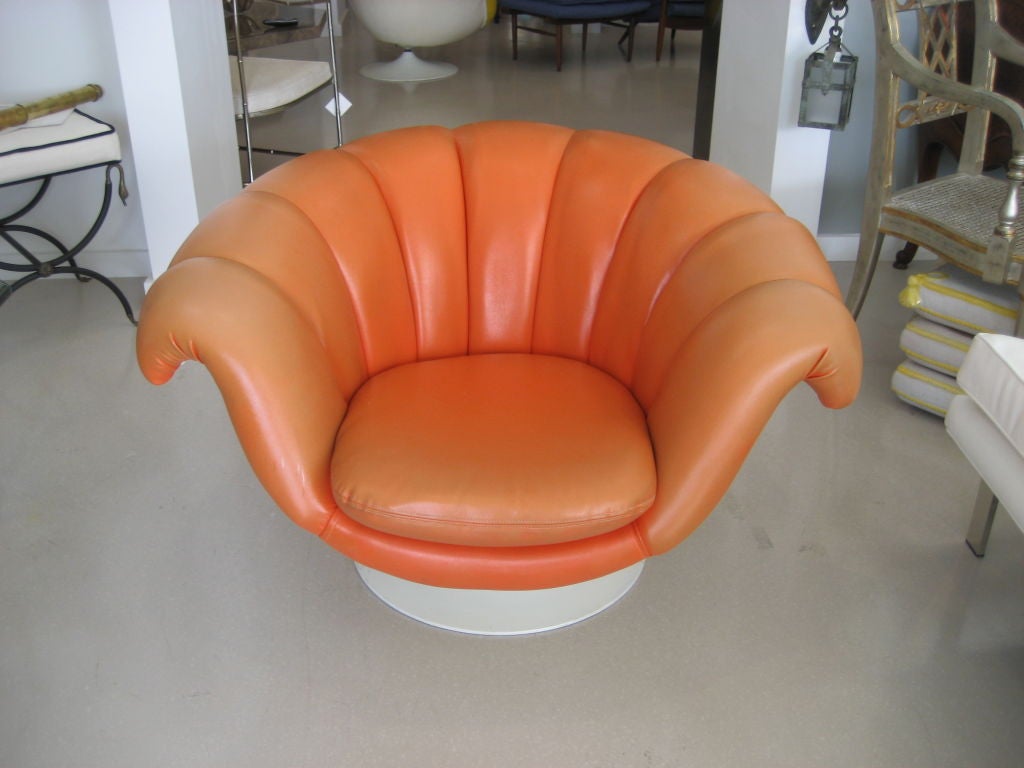Bold orange mid century modern fiberglass armchair. Yellow version also available.