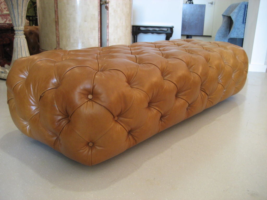 George Smith labeled chesterfield brown leather ottomans. One  available