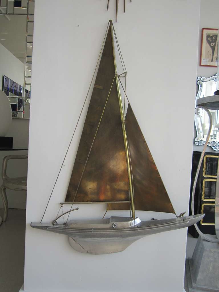 C. Jere signed two tone unusual sailboat wall sculpture.