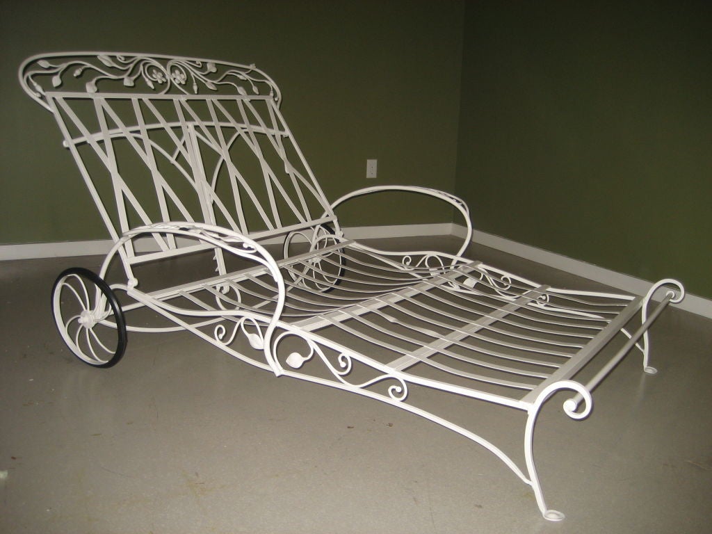 Rare Salterini wrought iron double lounge chair on wheels with vine motif.  Recently professionally powdercoated in white