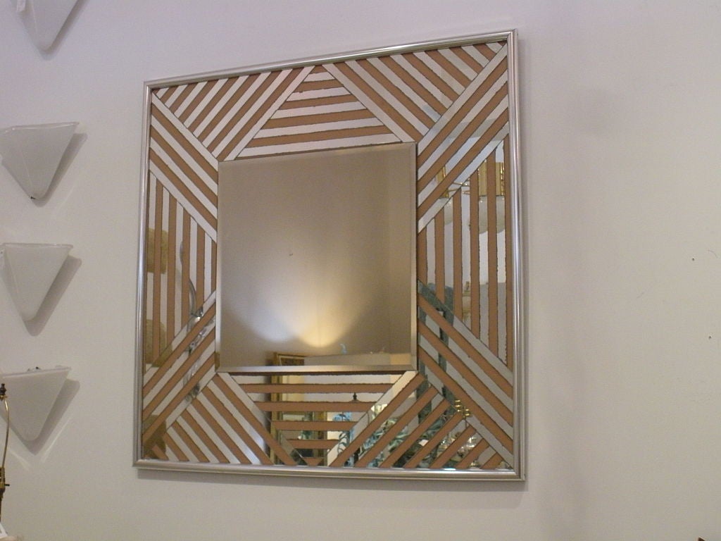 Geometric 1970s mirror with chrome edge.