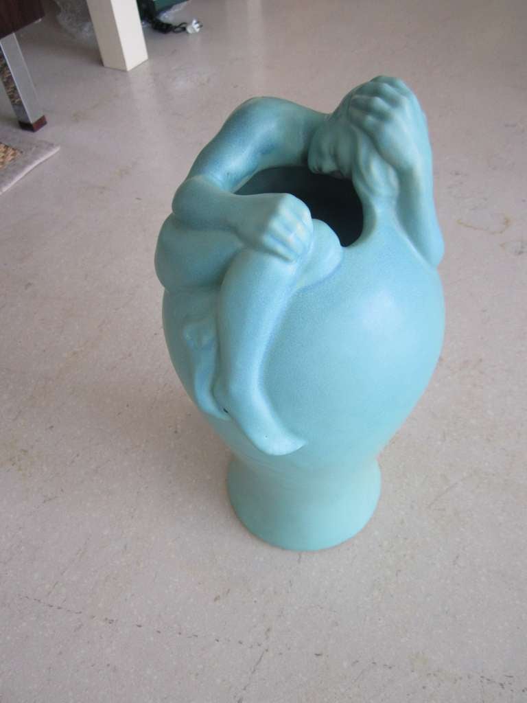 Iconic and hard to find figural vase by Van Briggle art pottery studio.The male figure in repose is entitled 