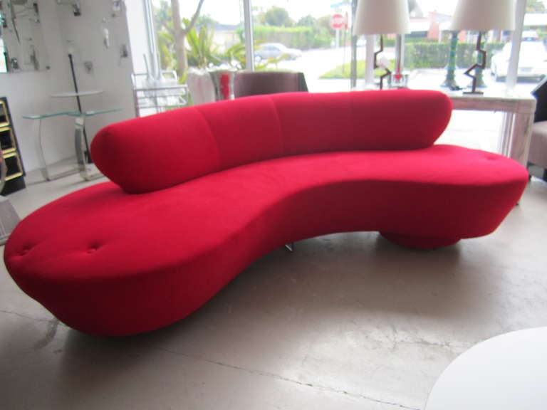 Vladimir Kagan red serpentine sofa with original Directional labels.
Sofa is in original red ultrasuede-- and is absolutely mint condition.