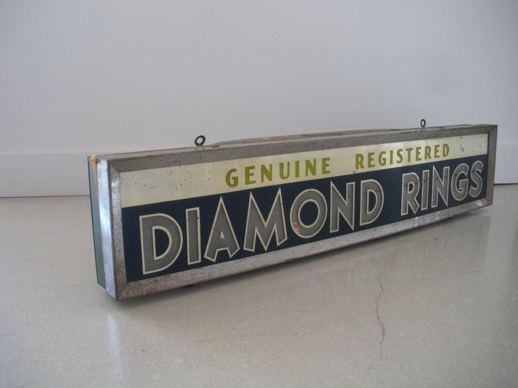 Vintage sign from an American jewelry shop advertising diamond rings.