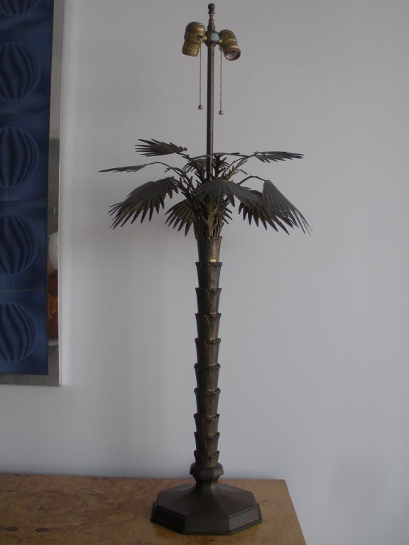Pair of highly detailed brass palm tree lamps with black tole shades.