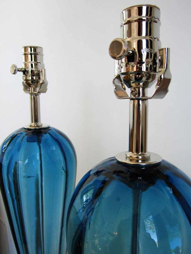 Pair of newly restored vintage blue murano glass lamps with a reversed teardrop shape with Lucite bases.