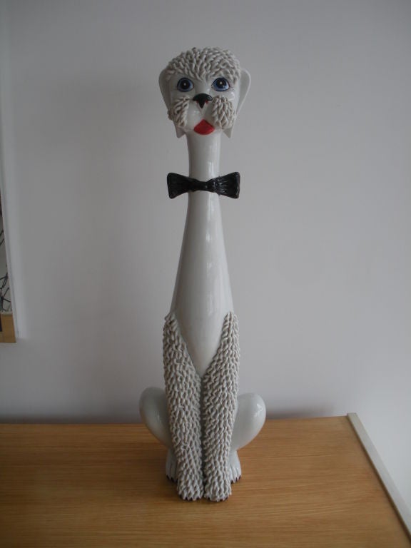 Highly detailed Italian ceramic poodle with bowtie.