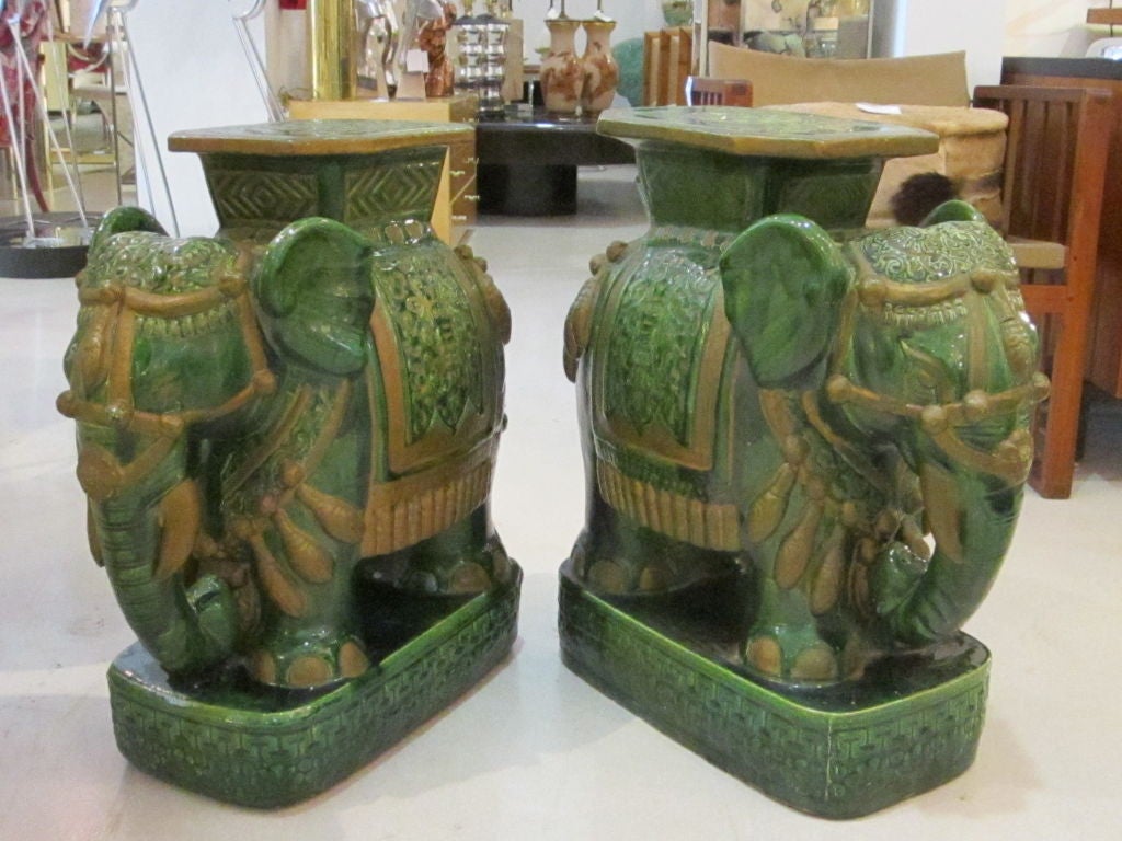 Rare pair of green and gold elephant garden seats from Vietnam. This pair is highly detailed and attractive from all angles.