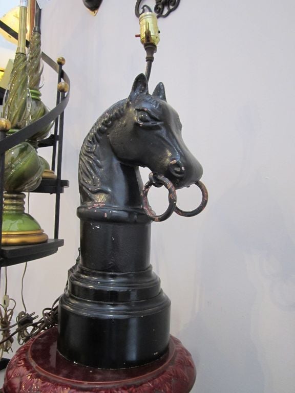 Vintage iron horse lamp with original black paint.