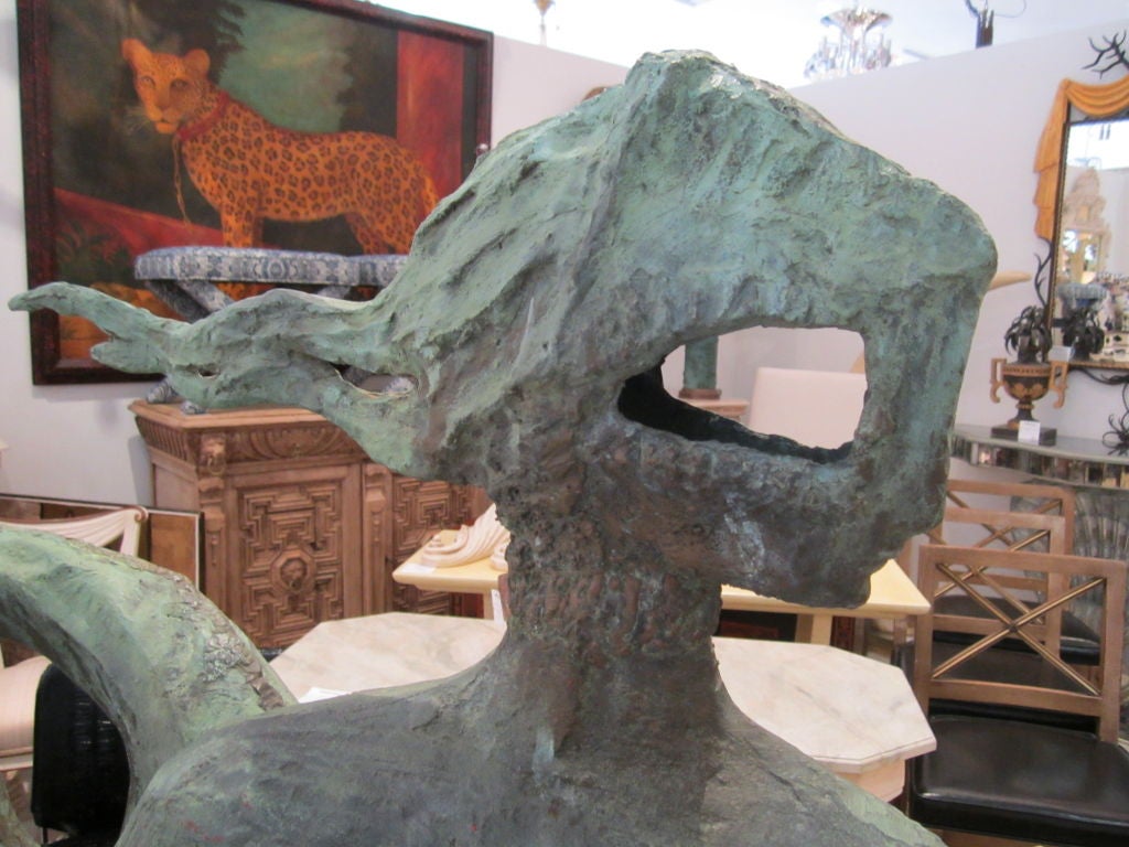 Bronze 1960's mermaid sculpture by the Greek artist Ikaris.The black plinth is custom and the sculpture may be removed from plinth.