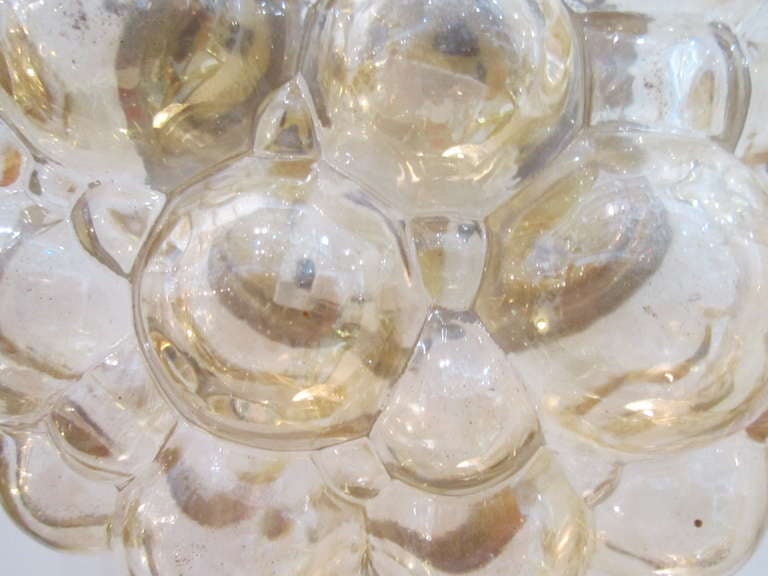 One of several Austrian glass bubble flush mount light fixtures-- some circular and some oval. Sold individually.