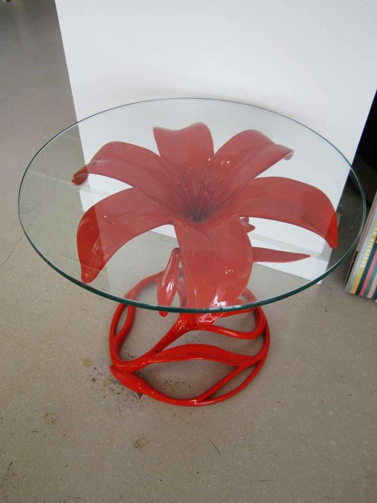 Pair of aluminum orange 'lily' flower side tables with round glass tops by Arthur Court.