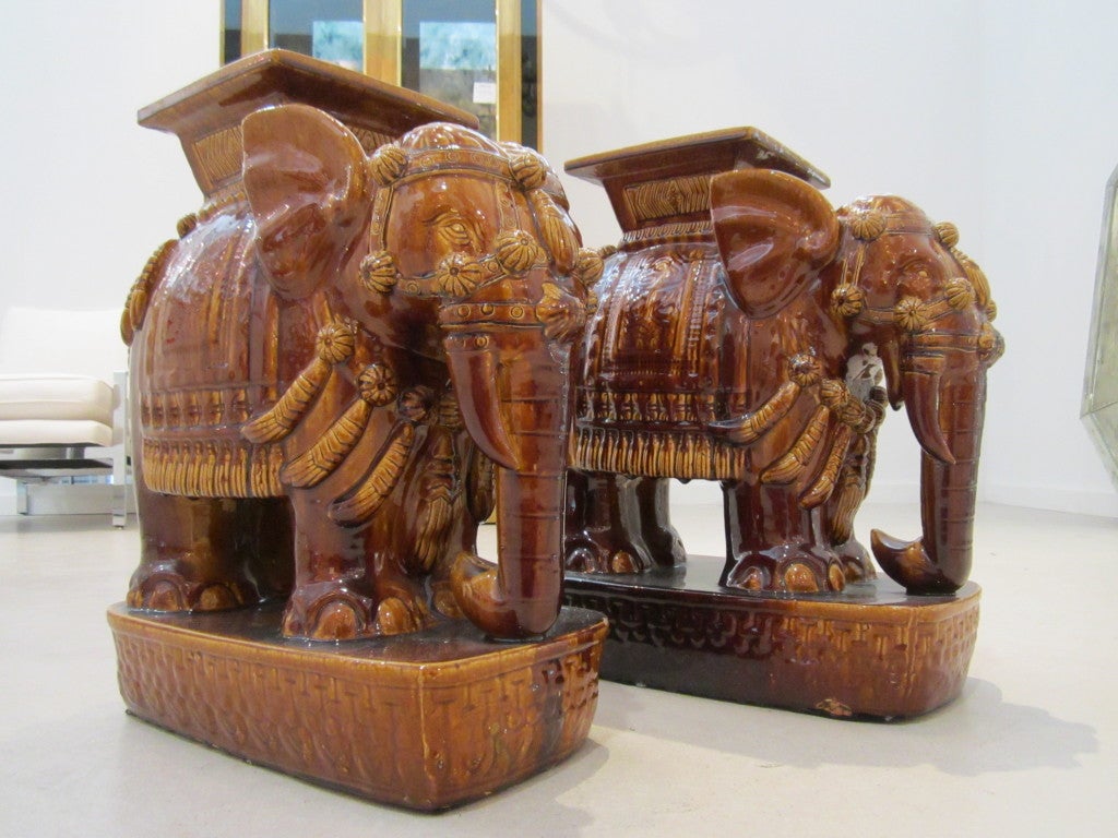 Pair of vintage brown elephant garden stools.
