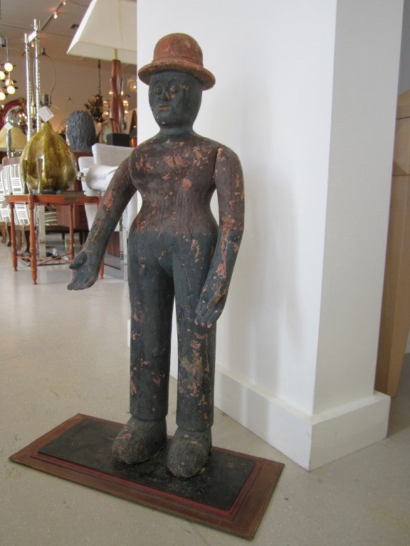 Carved primitive sculpture of a man