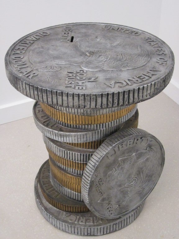 Two tone stack of coins table- featuring an American quarter on top as a liberty dime on the side.