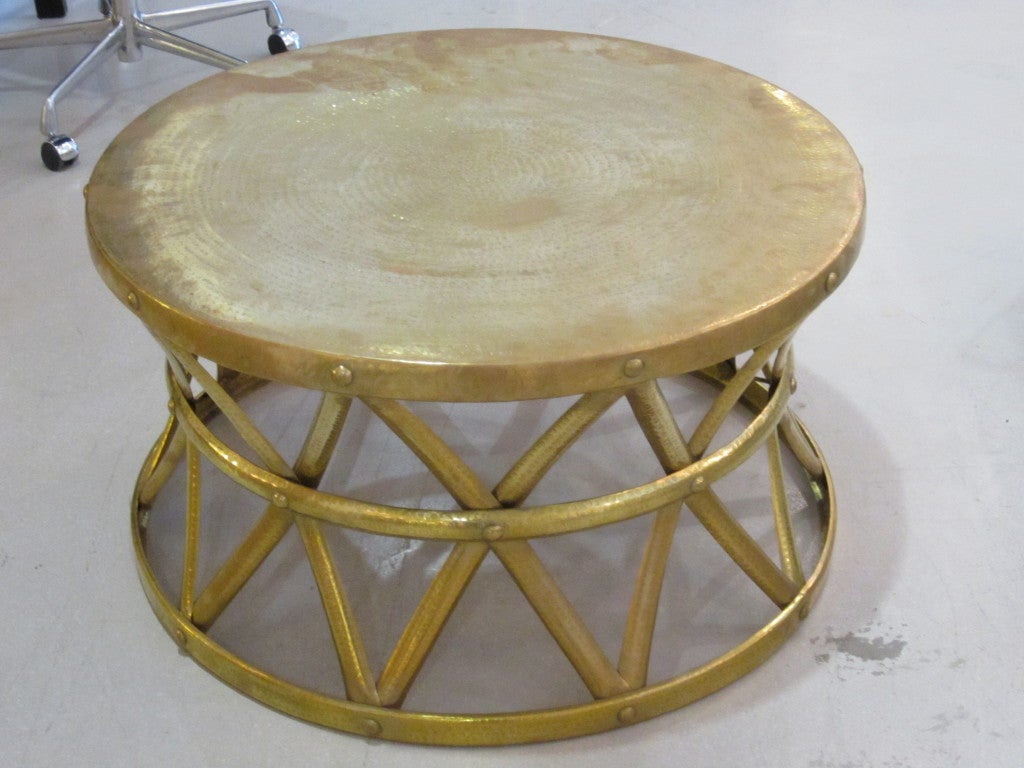 Large hammered brass drum coffee table.