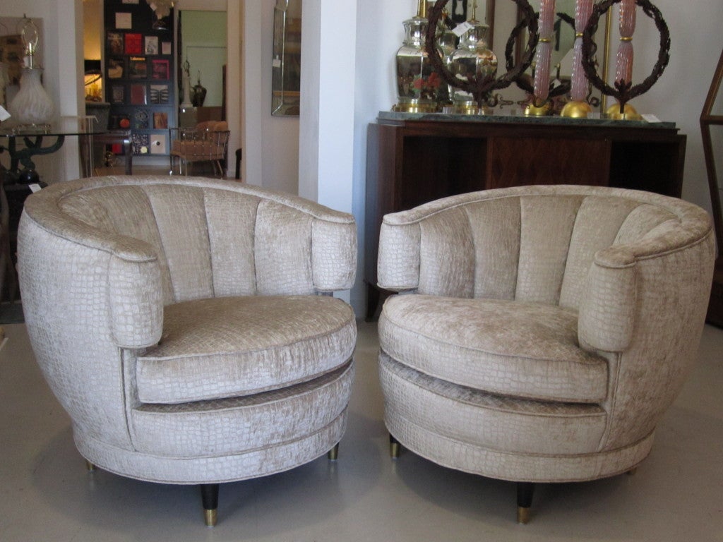 Pair of vintage tub shaped armchairs reupholstered in beige tone on tone python print velvet fabric.