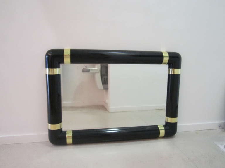 Mid-Century Modern Lacquer Mirror with Brass Strap Motif