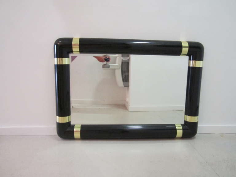Lacquer Mirror with Brass Strap Motif In Excellent Condition In West Palm Beach, FL