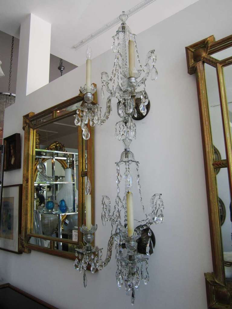 Pair of vintage classical crystal sconces - electrified with two candelabra each.