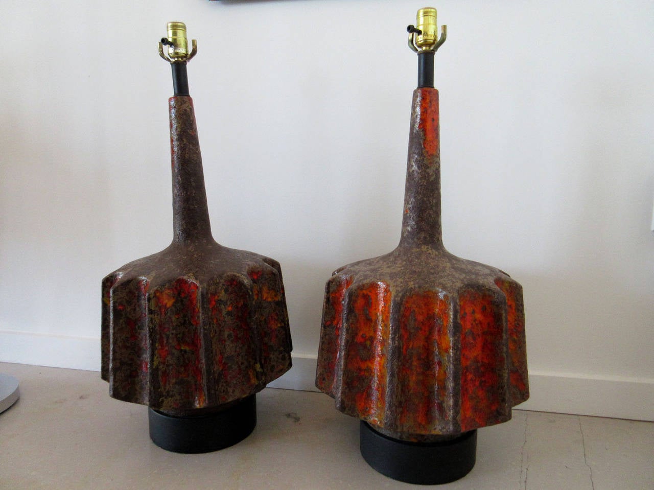 Pair of reddish black ceramic volcanic glaze lamps.