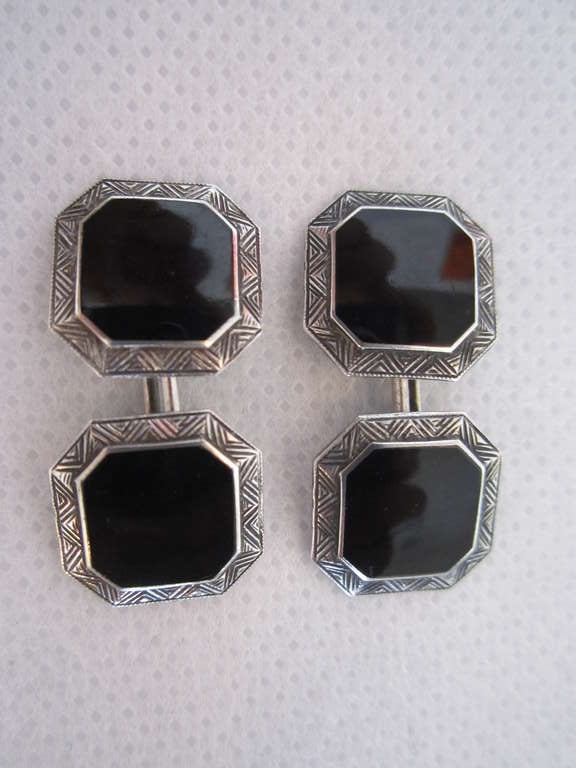 Pair of Art Deco sterling silver and black enamel cufflinks with zig zag motif.