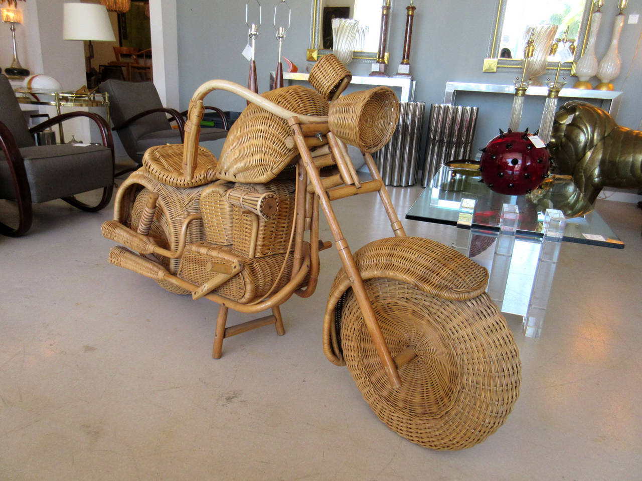 Vintage wicker motorcycle made with precise detailing that includes dual exhaust, rear suspension coils and handle bar brakes.