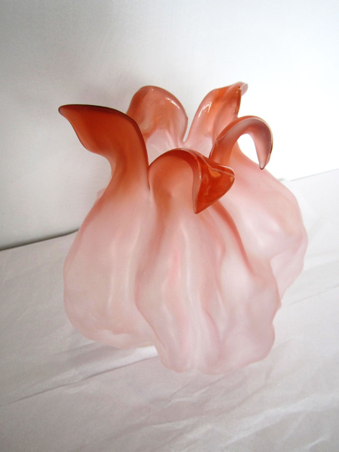 Single pink organic flower vase signed and numbered on the bottom.