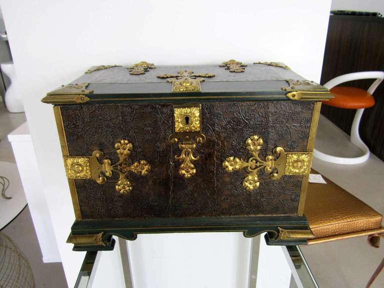 A 19th century Continental casket or box with embossed surfaces and cast dore bronze strap work accents.
