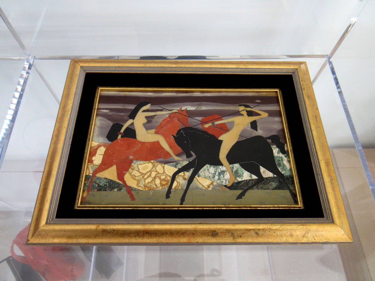 Vintage pietra dura framed plaque depicting two female nudes on horseback. Modernist in style the image is bold and framed in original gilt wood frame.