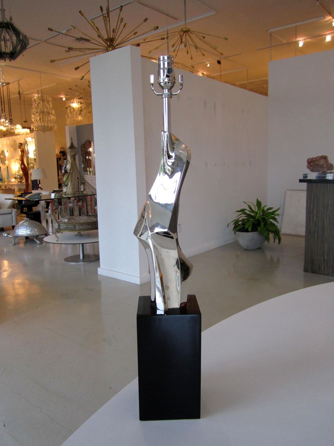 Pair of sculptural nickel-plated lamps manufactured by Laurel.