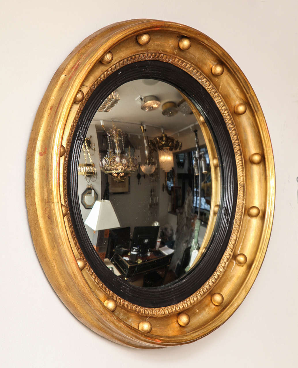 Giltwood An English Regency Bulls Eye Mirror