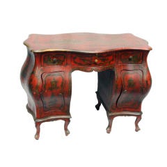 An Italian Rococo Kneehole Desk with Bombe Front, Sides and Back