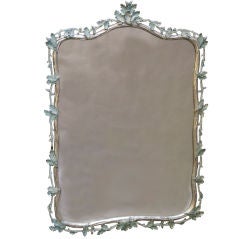 An Italian Rococo Style Mirror with Carved Trompe L'oeil Frame