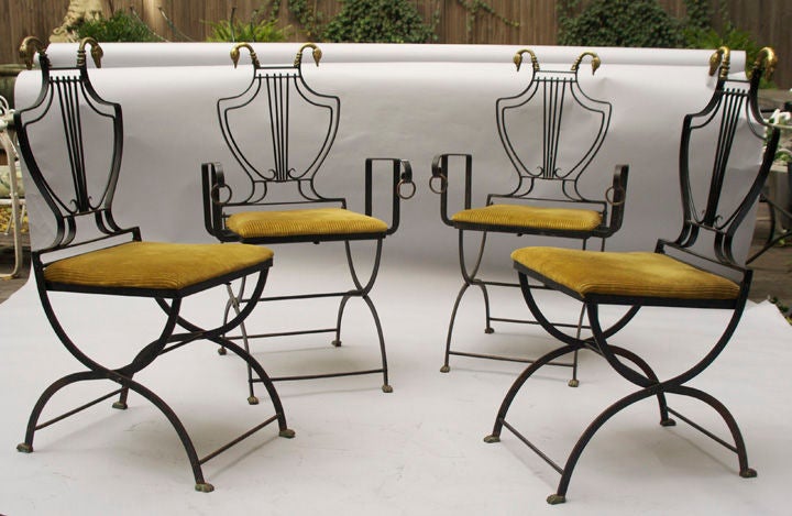 A Set of 4 Iron Directoire Style Chairs with Swan's Head Details