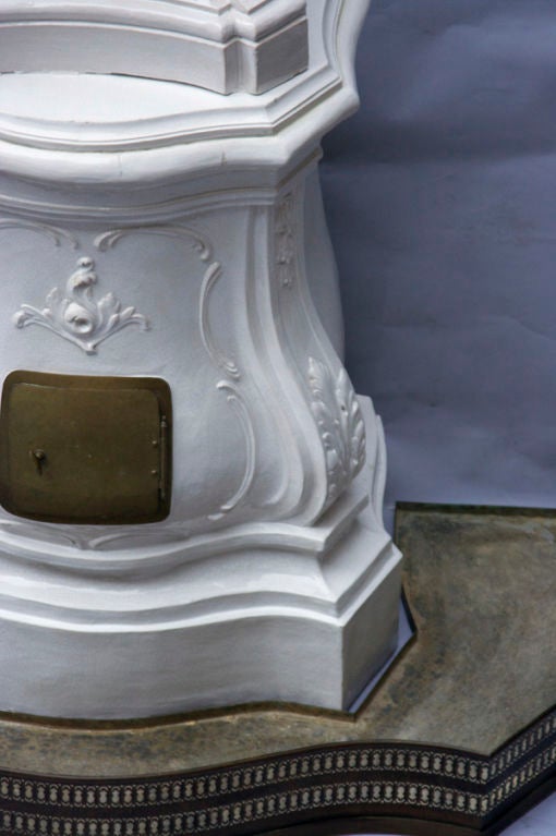 An Italian Rococo Porcelain Terra Cotta Stove with Brass Door 1